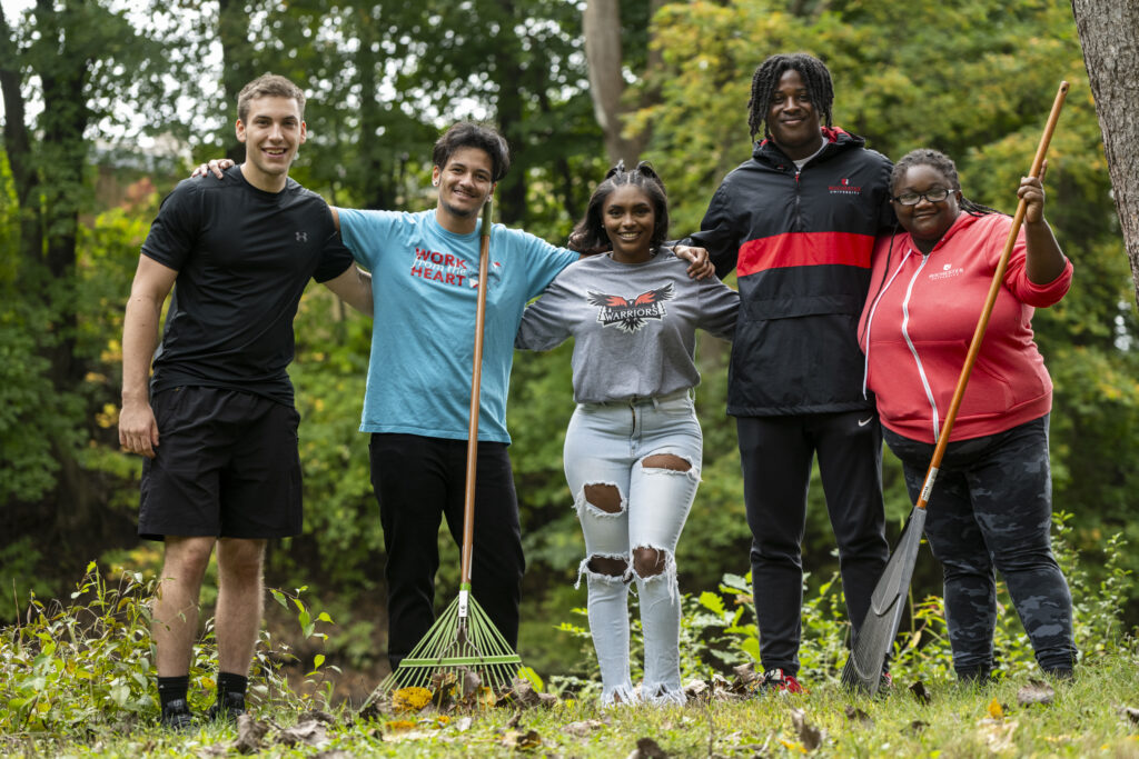 students outside with rake